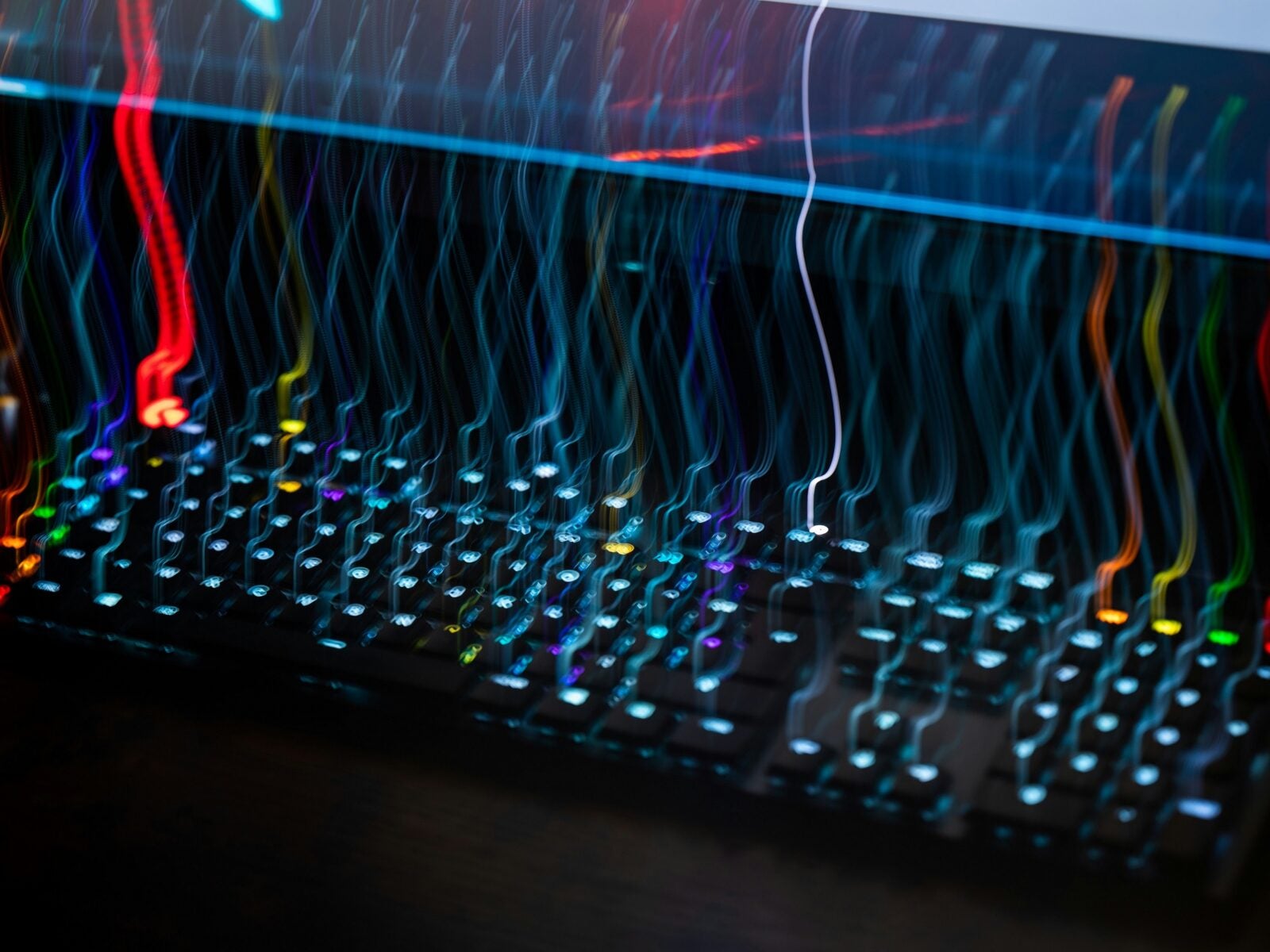 a close up of a computer keyboard with colorful lights
Photo by Adrien on Unsplash
